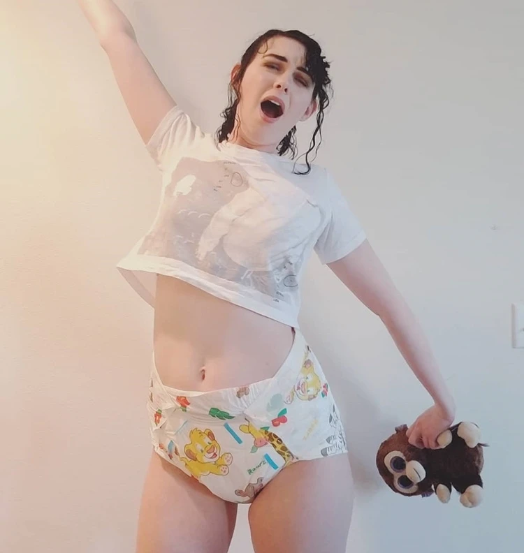 adult baby girl posing in diapers and pampers